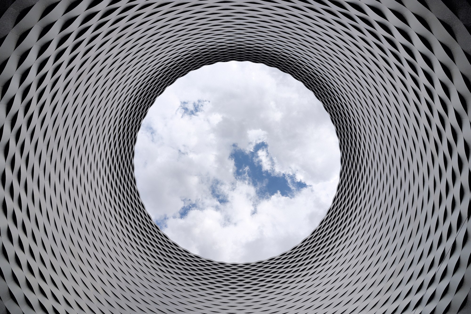 An architectural courtyard opening toward the sky